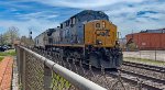 CSX 7040 hauls empty sand cars west.